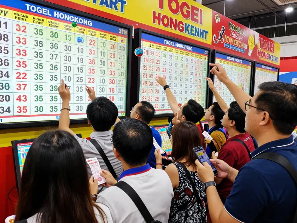 Excited participants in dynamic HK Togel Hongkong betting scene during live draw.